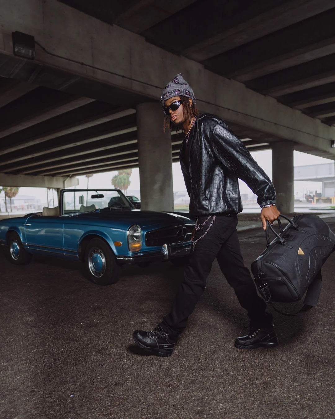 BLACKED OUT EMBOSSED GOLD TOOTH DUFFLE