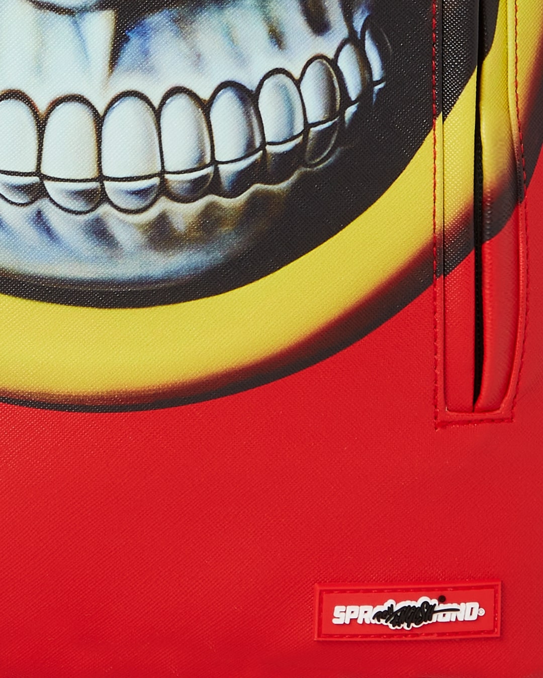 RON ENGLISH RED GRIN DLXSV BACKPACK