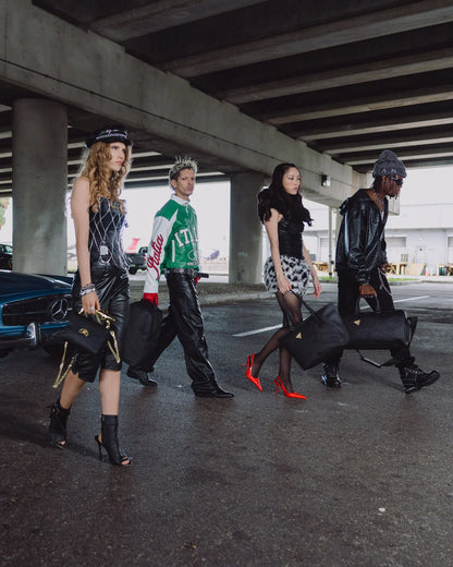 BLACKED OUT EMBOSSED GOLD TOOTH DUFFLE