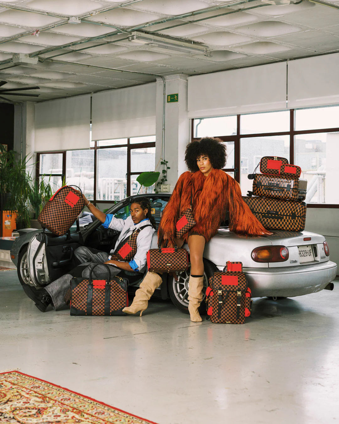 RED REDEMPTION PYRAMID DUFFLE