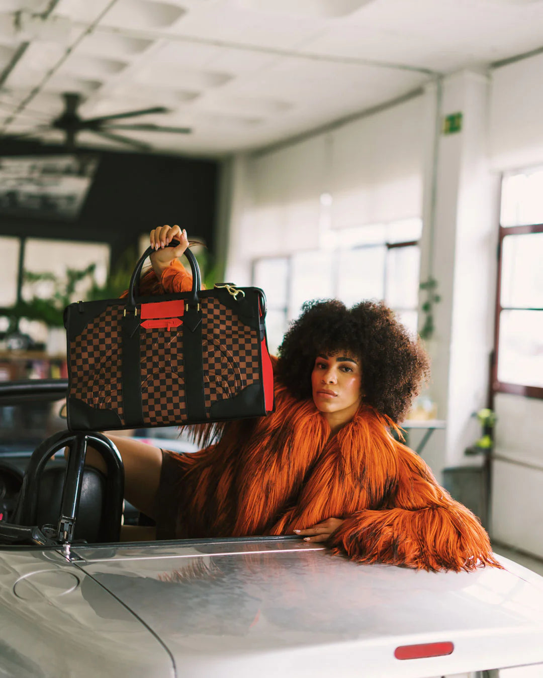 RED REDEMPTION PYRAMID DUFFLE